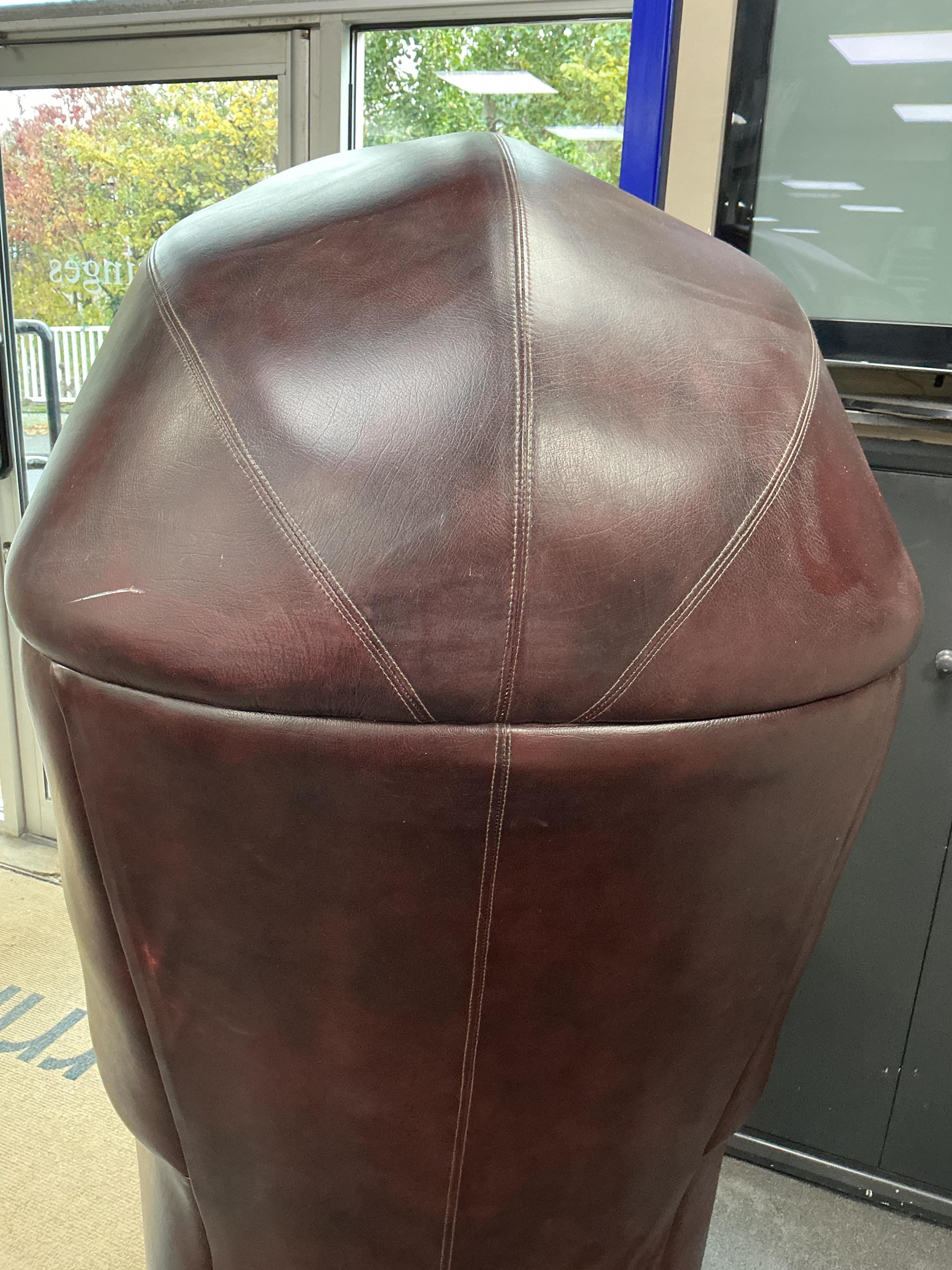 A reproduction buttoned burgundy leather hall porter's chair, width 88cm, depth 64cm, height 176cm